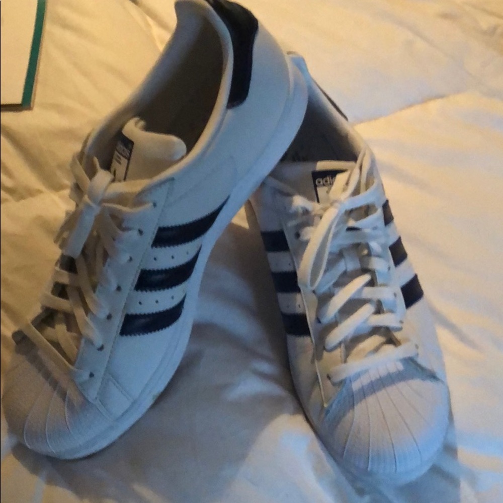 New Adidas navy size 11. Perfect condition.
